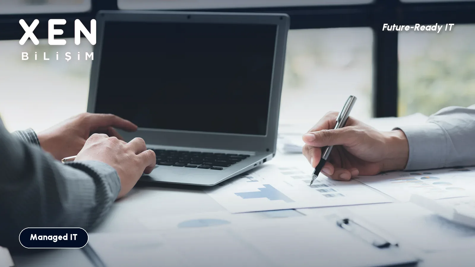 Team reviewing an IT maintenance quote with a laptop and cost calculations — managed IT pricing — Xen Bilişim