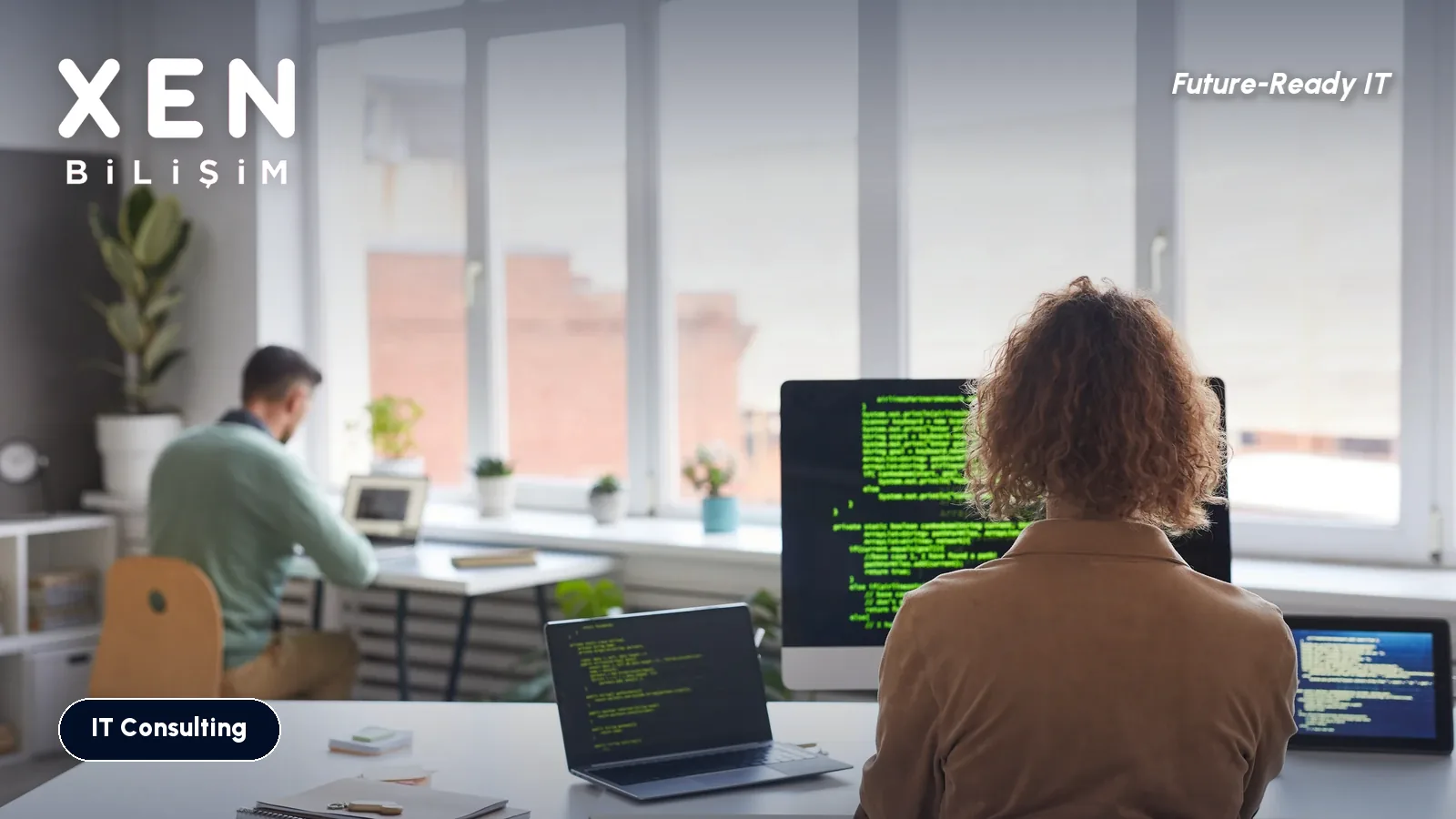 Staff working at computers in a bright office, Windows 10 ESU year two decision — Xen Bilişim